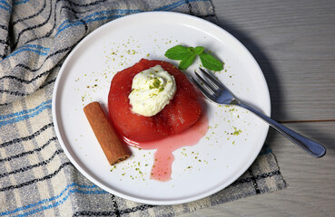 Ayva Tatlısı - Quince dessert served with clotted cream and powdered pistachios