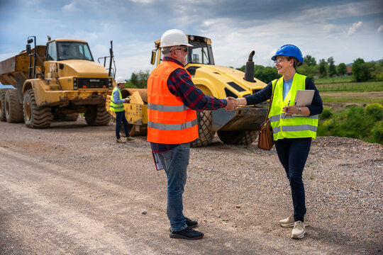 Highway engineers discuss and plan.