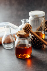 Honey Jar with Wooden Dipper and Various Glass Containers