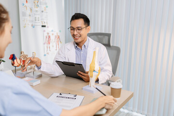 Fototapeta premium Medical professionals collaborating during a meeting to discuss patient care plans and treatment strategies. Doctors and nurses share expertise and analyze clinical data for better healthcare outcomes