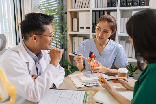 Medical professionals collaborating during a meeting to discuss patient care plans and treatment strategies. Doctors and nurses share expertise and analyze clinical data for better healthcare outcomes