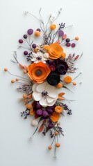A cascading arrangement of handcrafted paper flowers and foliage in autumnal colors like orange, deep purple, and white, set against a clean white backdrop.