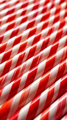 Colorful red and white striped paper straws.