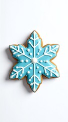 Decorated snowflake cookie for festive occasions.