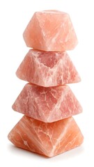 Stack of four himalayan pink salt bricks on white 
