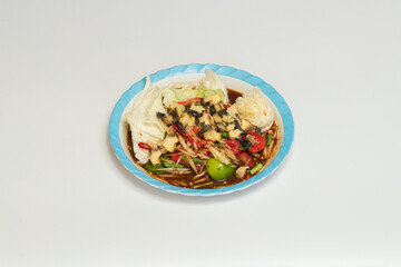 Green papaya salad Thai cuisine spicy delicious. Thai call "SOM TAM". Famous Thai food, papaya salad, Somtum, Papaya Pok Pok. Closeup Thai Green Papaya Salad with peanuts.