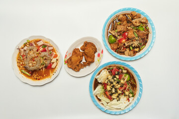 Green papaya salad Thai cuisine spicy delicious. Thai call "SOM TAM". Famous Thai food, papaya salad, Somtum, Papaya Pok Pok. Closeup Thai Green Papaya Salad with peanuts.