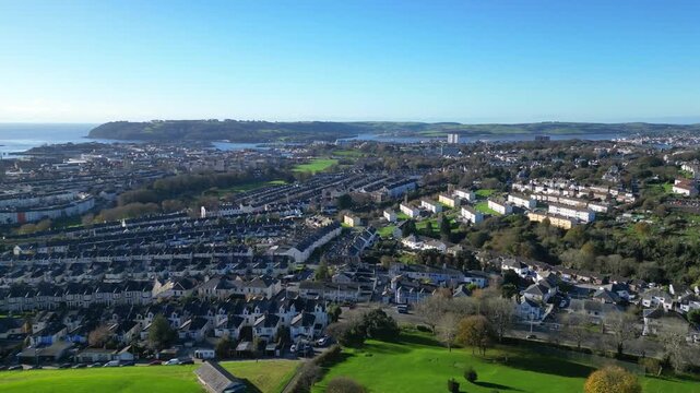 Plymouth, Devon, England: DRONE VIEWS: The drone shows the houses of Stoke Village in the foreground and the River Tamar and Devonport Docks in the distance. Plymouth is a historic naval port (3).