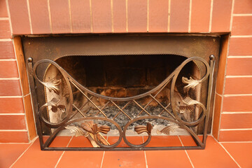 Naklejka premium Decorative Metal Fireplace Screen in Brick Hearth