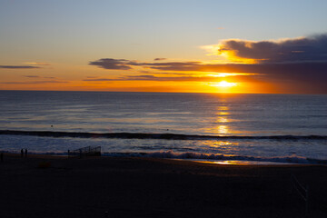 Golden sunset over the Pacific Ocean at Redondo Beach, reflecting on the water.