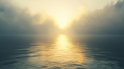 Obraz premium A serene sunrise over water, with fog creating a mystical atmosphere and reflecting golden light on the calm surface.