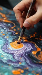 Obraz premium The artist creates a mesmerising whirlwind of colours, mixing shades of orange and purple on canvas, perfect for an atmospheric backdrop in an art studio or creative workshops.