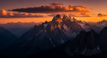 Dramatic mountain range at sunset with golden light