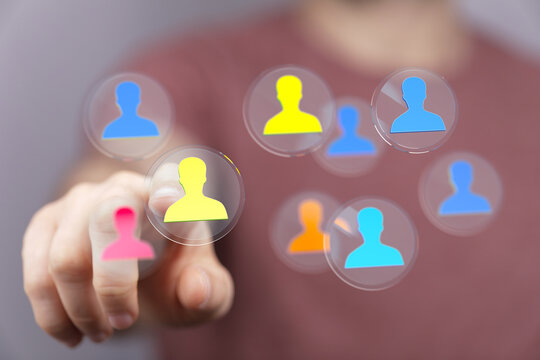 Hand pressing a digital interface icon representing networking, teamwork and connection with others. Perfect for business and collaboration conc - Powered by Adobe