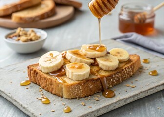 Enjoy a healthy breakfast toast with peanut butter and banana slices drizzled with honey kitchen recipe guide morning nutrition balanced meal concept