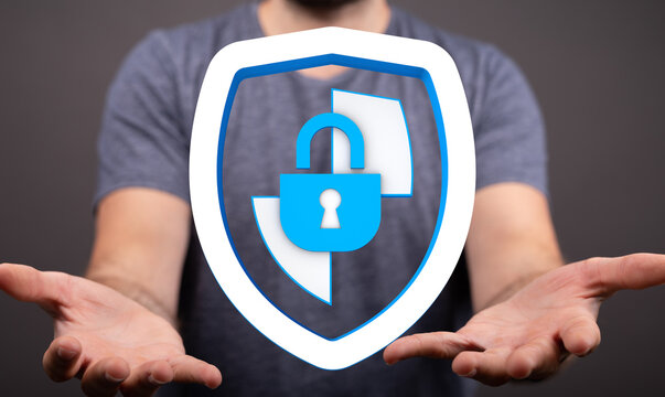 A person holding up a shield icon with a padlock, symbolizing digital security, online protection, and data safety. Illustrating the - Powered by Adobe