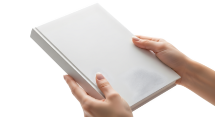 Hands holding a white book with a blank cover against a black background in a studio setting