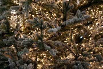 Close-up of a Christmas tree with illumination. Christmas background. 