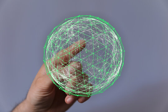 A hand cradles a glowing green digital globe representing global connectivity, technology, and innovation. Perfect for illustrating concepts of - Powered by Adobe