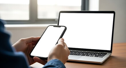 Cell phone and laptop white screen mockup,blank screen while working on laptop at office,Woman hand holding mobile phone Business woman using smartphon