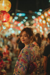 Obraz premium Japanese Woman in Floral Yukata at Vibrant Night Festival