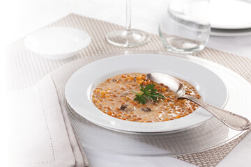 Lentil soup with seasonal vegetables and pork.