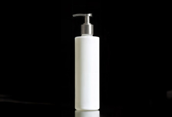 White Cosmetic Pump Bottle on Black Background