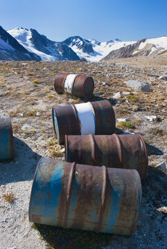 Fuel drums abandoned by miners and left to rust and leak into the wilderness watershed of Salal Creek, British Columbia