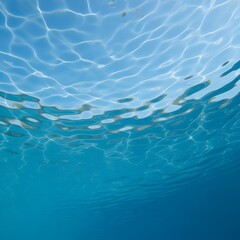 Underwater light patterns create abstract design on blue water surface perfect for backgrounds