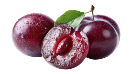 Close-up of fresh ripe red plums with one cut in half showing juicy interior, green leaf, and water droplets, on a white background, ripe and