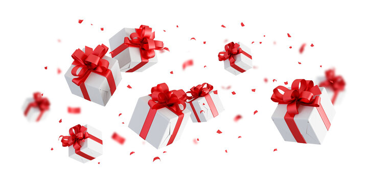 christmas gift boxes with red ribbon and confetti flying isolated on white