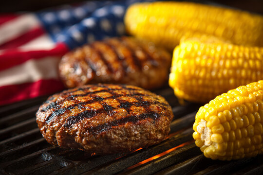Grilled burgers and corn on the cob with an American flag backdrop, representing summer fun and patriotism. Ideal for holiday, picnic, or food concepts. High quality - Powered by Adobe