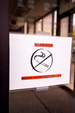 No smoking sign on a glass door