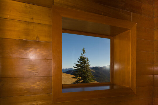 Fototapeta View through a cabin window from Hurricane Ridge to the Olympic Mountains and Olympic National Park