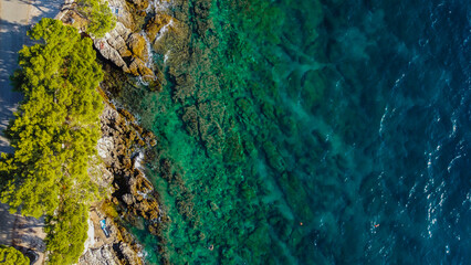 Summer Yachting on the Croatian Archipelago: Elevated view of boats cruising past small islands and clear turquoise coves