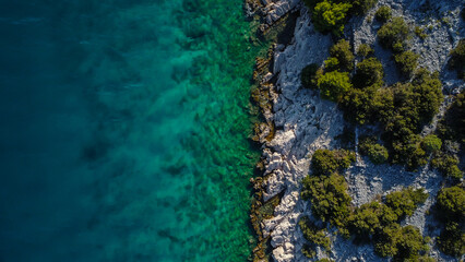 Rocky Mediterranean Coastline Showing the Dramatic Color Change from Deep Blue Ocean to Shallow Turquoise Water
