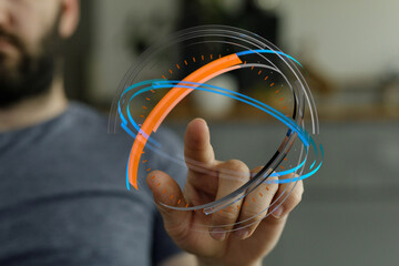 A close up shot of a man's hand touching a glowing digital interface with a futuristic design....