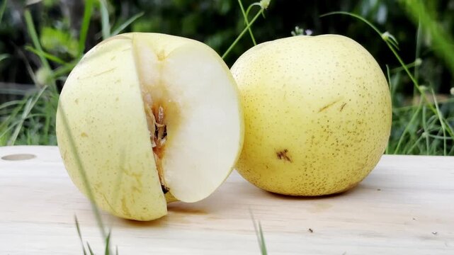 Fresh and Juicy Asian Pears on Wooden Surface.