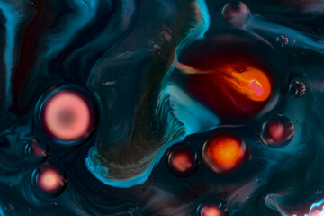 Macro of blue, black orange liquid art with bubbles and glowing color, futuristic cosmic science pattern. Ideal for in high-tech, or sci-fi projects, posters, web design, visual branding.