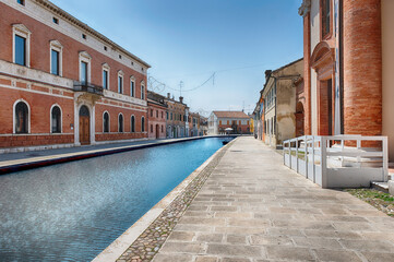 Walking among the picturesque canals of Comacchio, Italy