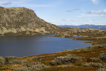  "Cozy Traditional Wooden Cabins Nestled Near Gaustatoppen, Norway's Majestic Peak Amidst Untouched Highland Lake"