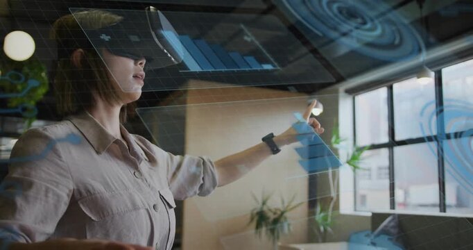 Woman in VR headset pointing, swiping holo bar charts, pinching to resize for business
