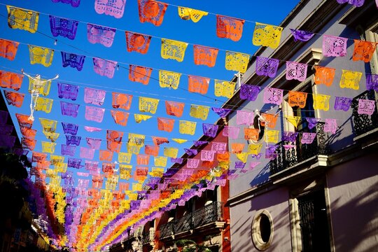 Celebratory Papel Picado Across Colorful Street (Oaxaca de Juarez, Mexico)