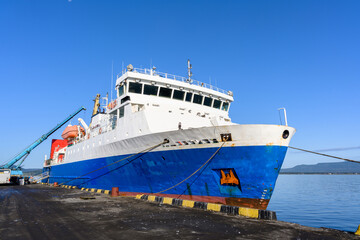 Naklejka premium Large research vessel docked in Yuzhno-Kurilsk