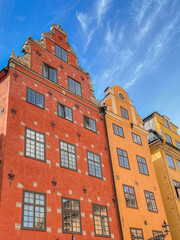 Fototapeta premium red and yellow buildings on central Stockholm square famous for markets and often seen on postcards