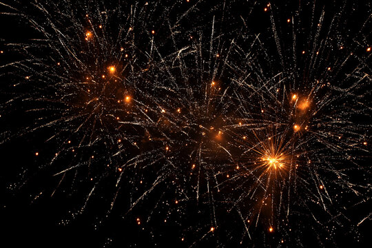 Golden fireworks exploding in night sky explosion