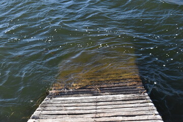 Submerged Wooden Dock in Clear Lake Water