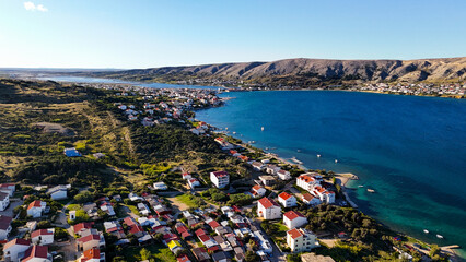 Aerial Drone View of Pag Island and the Coastal Town of Lun in Croatia. Stunning Adriatic Sea coastline, wild forests, rugged landscapes, and untouched Mediterranean nature captured from great height