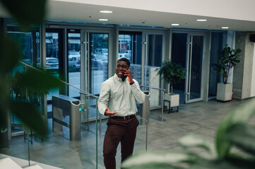 Young black businessman making a phone call