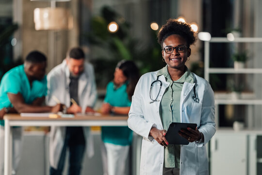African american doctor holding tablet in hospital